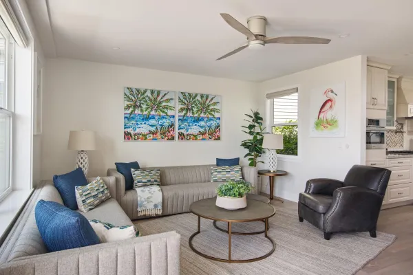 a living room with furniture and a glass window