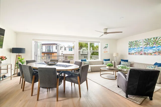 a view of a dining room with furniture and wooden floor