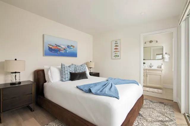 a room with a bed and a mirror