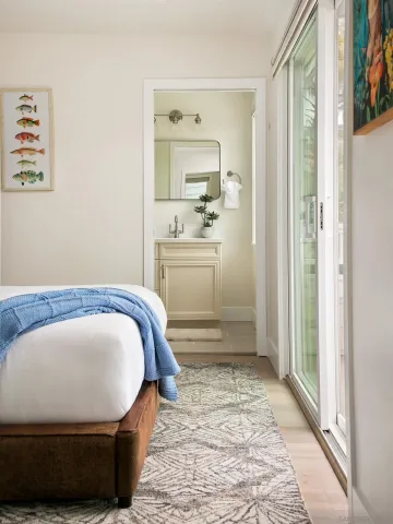 a view of bedroom with furniture and windows