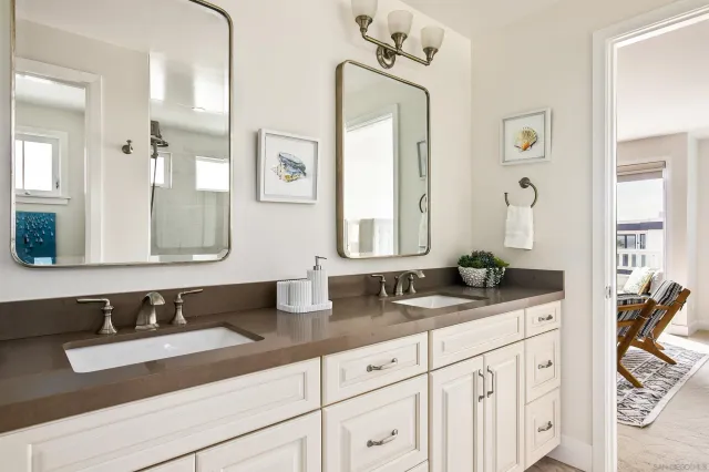 a bathroom with a glass shower door