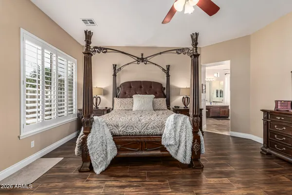 a view of room with window and wooden floor
