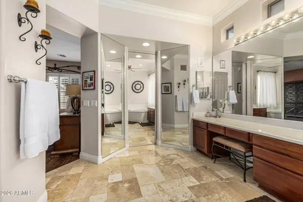 a view of a hallway with wooden floor and living room