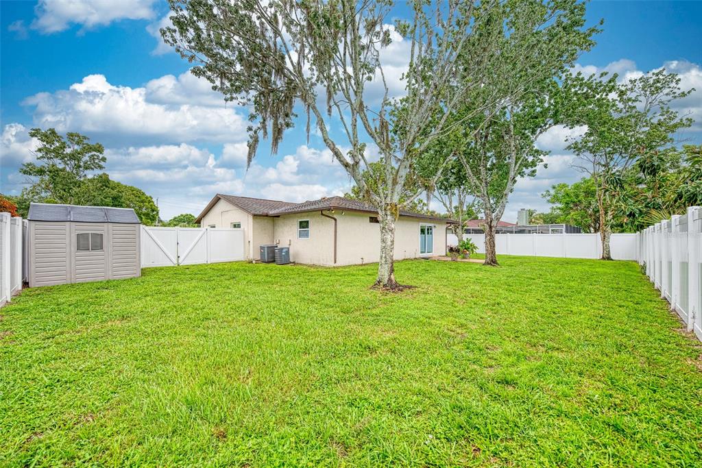 1330 Georgetowne Circle Sarasota, FL 34232 - Photo 38 of 46 a view of a house with a backyard