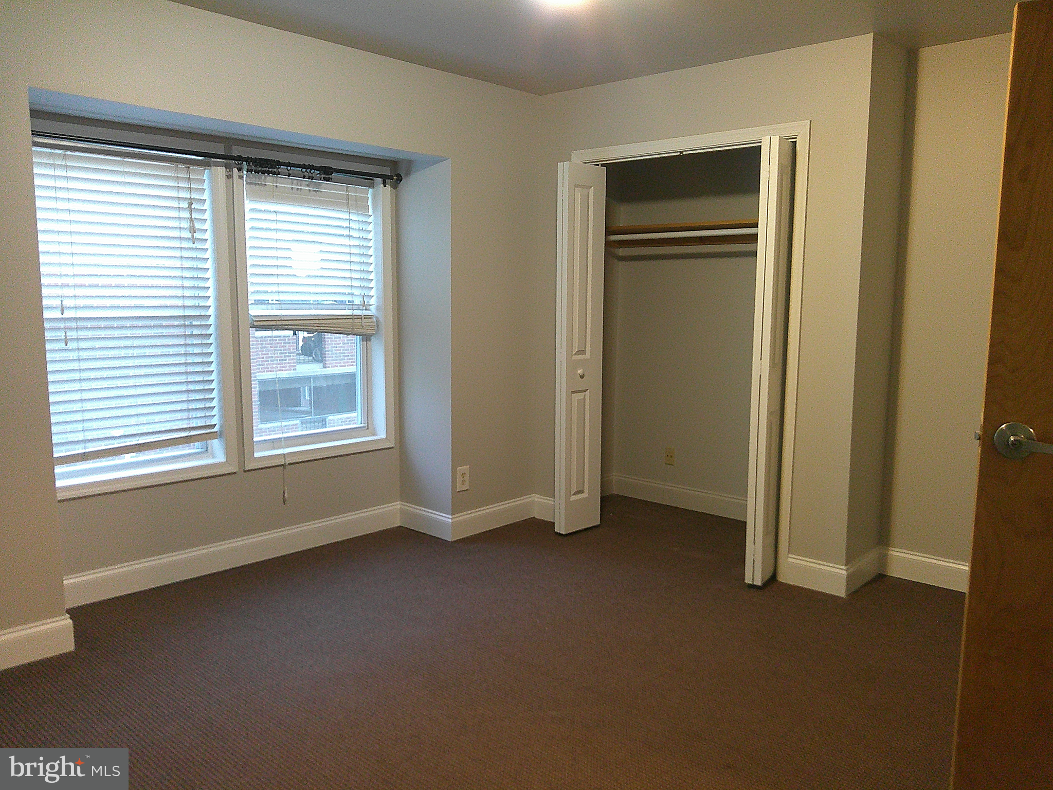 6 East 13th Street, Unit 3 Wilmington, DE 19801 - Photo 3 of 9 an empty room with windows