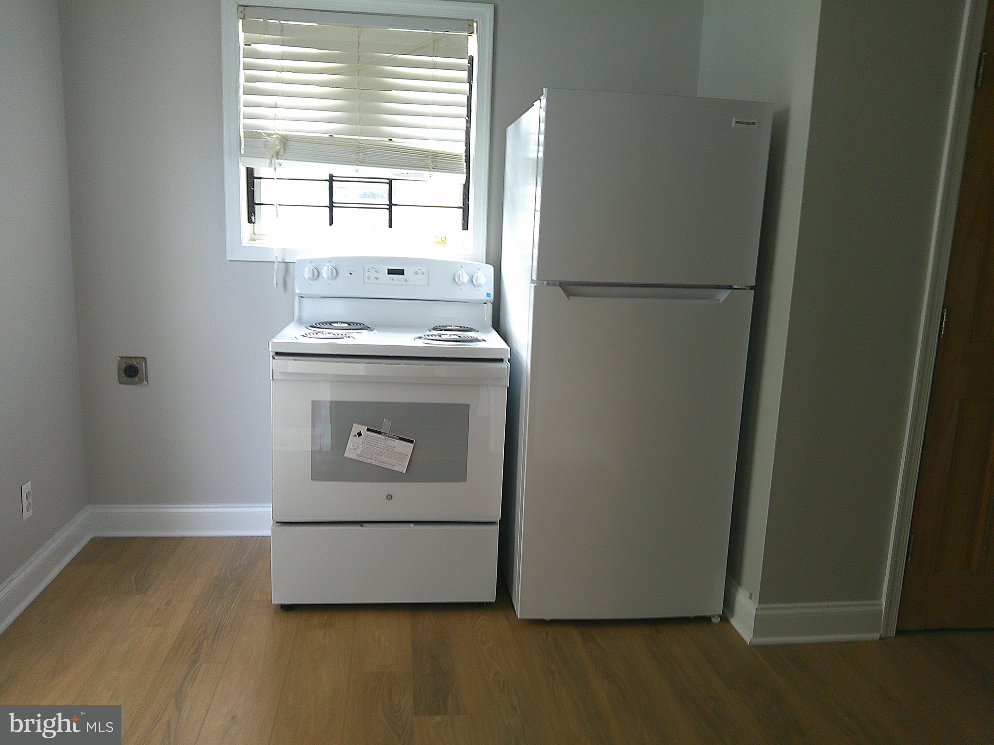 6 East 13th Street, Unit 3 Wilmington, DE 19801 - Photo 9 of 9 a view of kitchen with stainless steel appliances granite countertop cabinets and a window