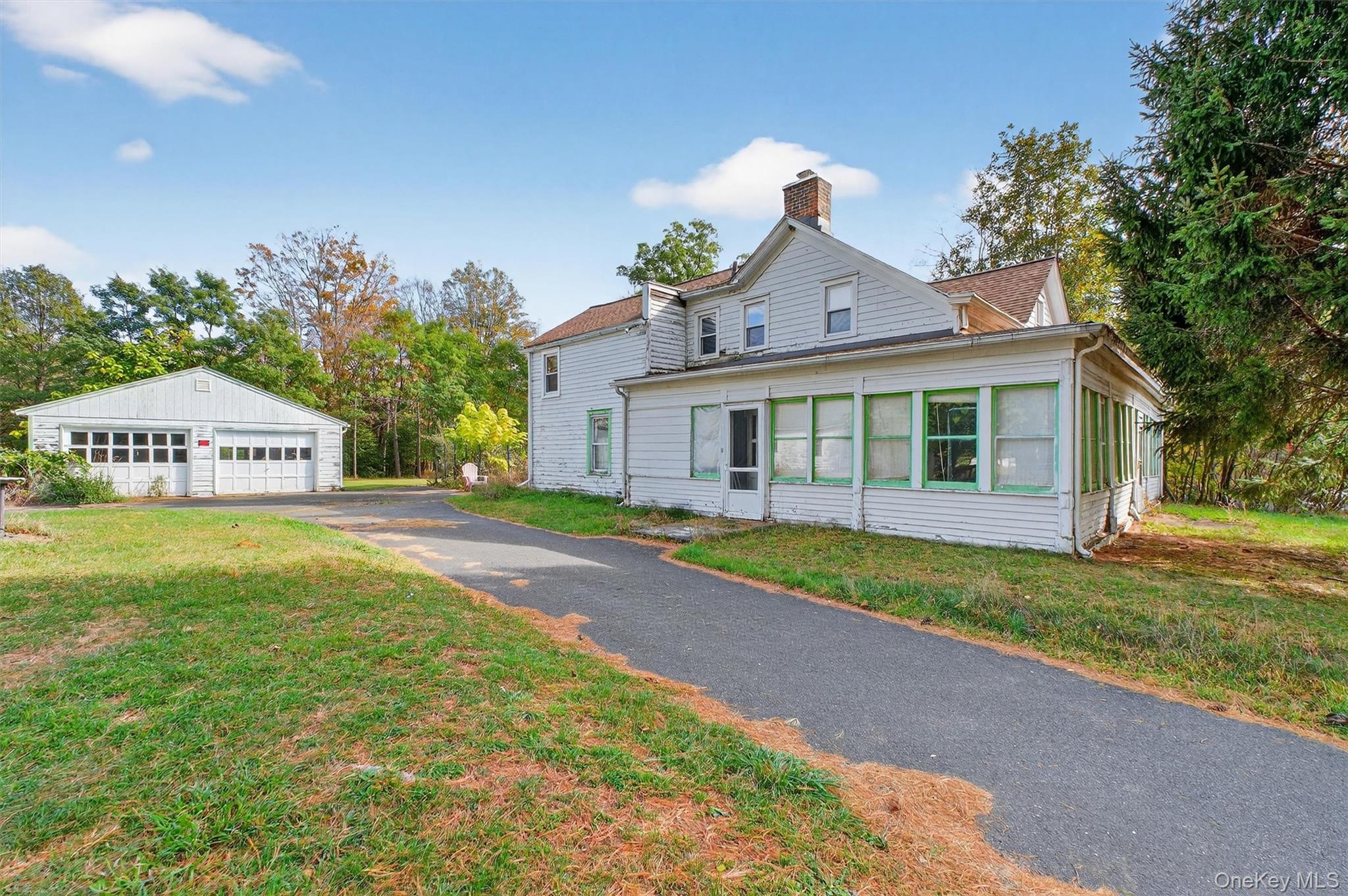 300 Band Camp Road Saugerties, NY 12477 - Photo 12 of 48 a front view of a house with a yard and garage
