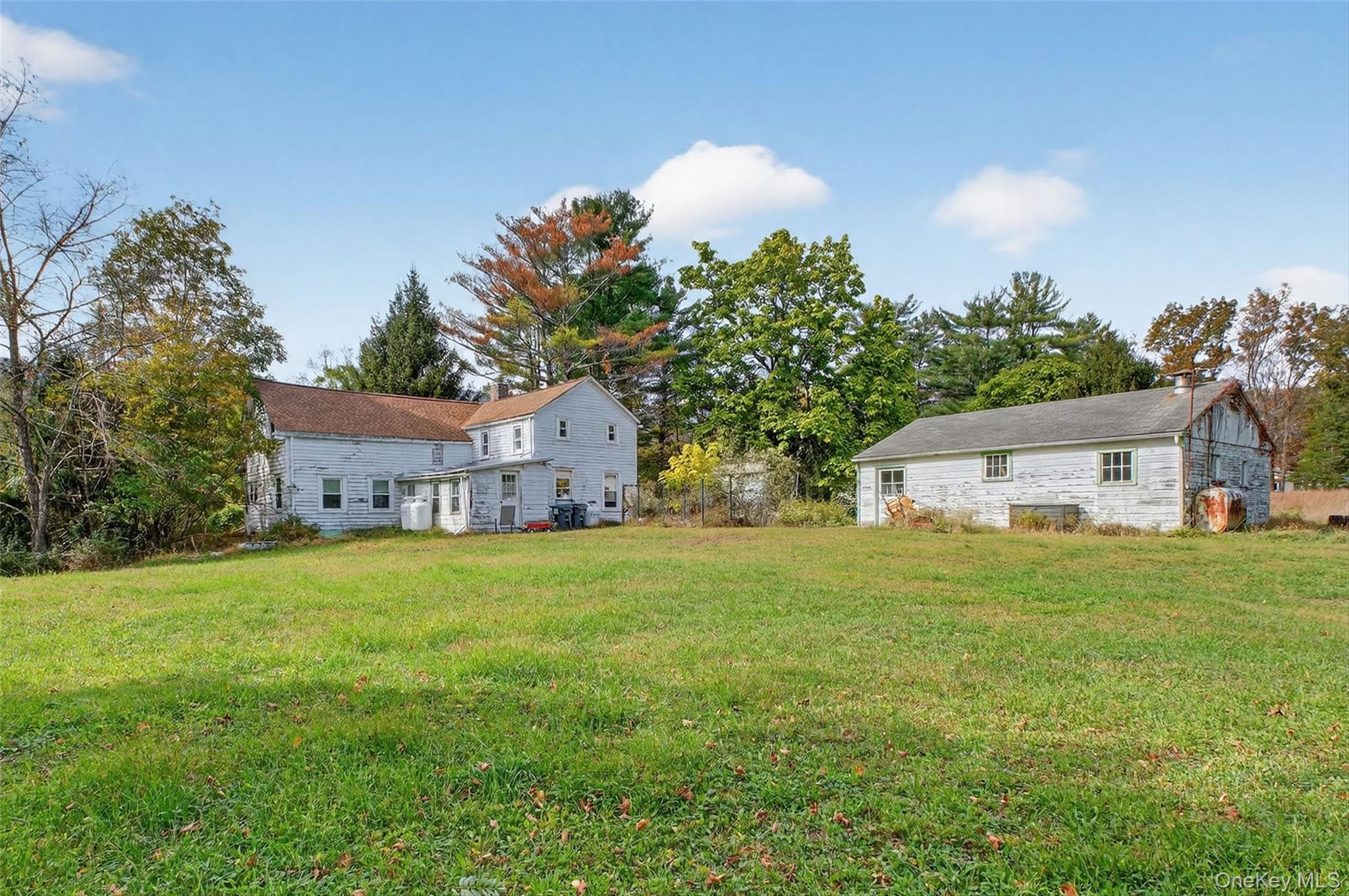 300 Band Camp Road Saugerties, NY 12477 - Photo 15 of 48 a front view of a house with a garden and trees