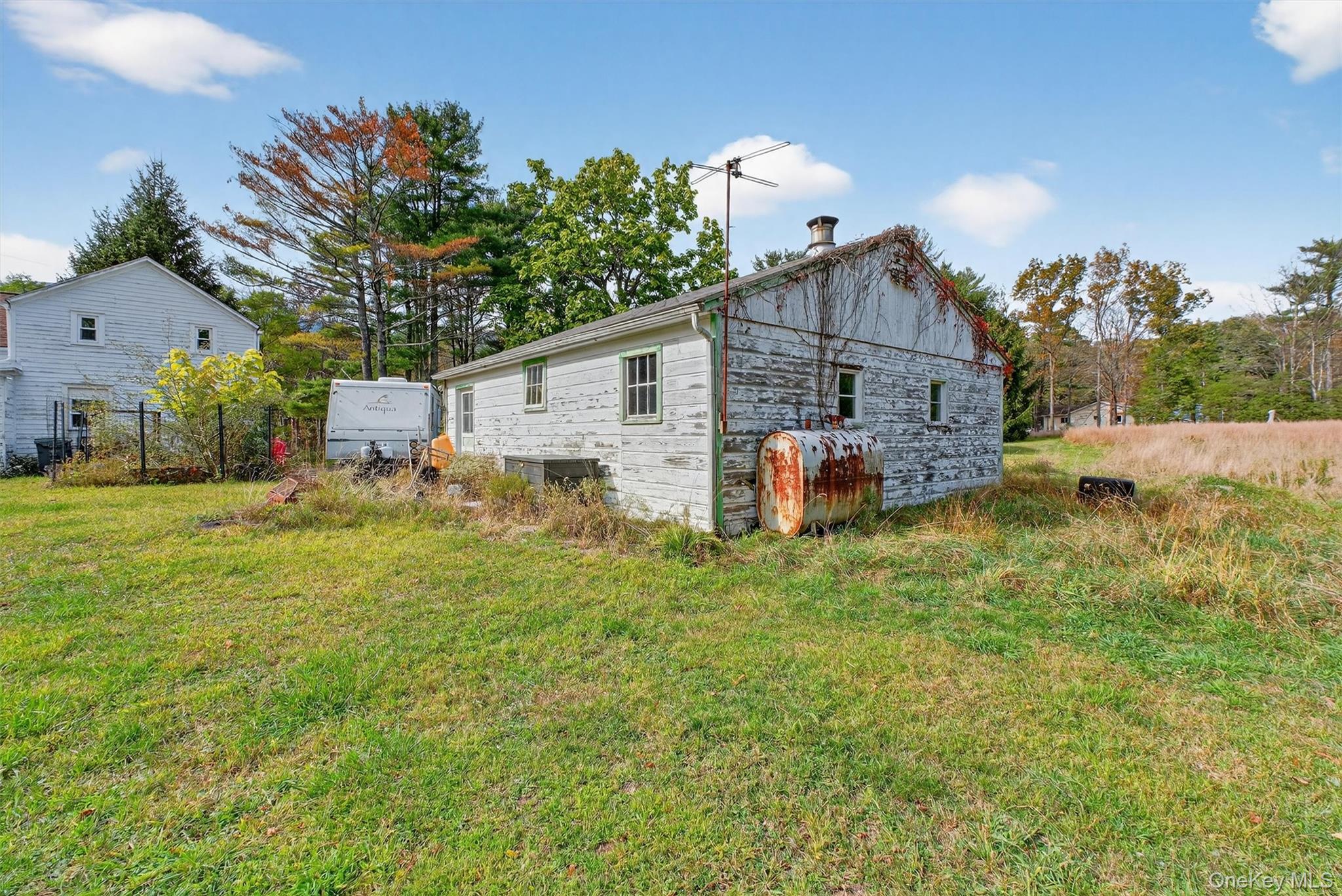 300 Band Camp Road Saugerties, NY 12477 - Photo 16 of 48 a front view of house with yard and trees in the background