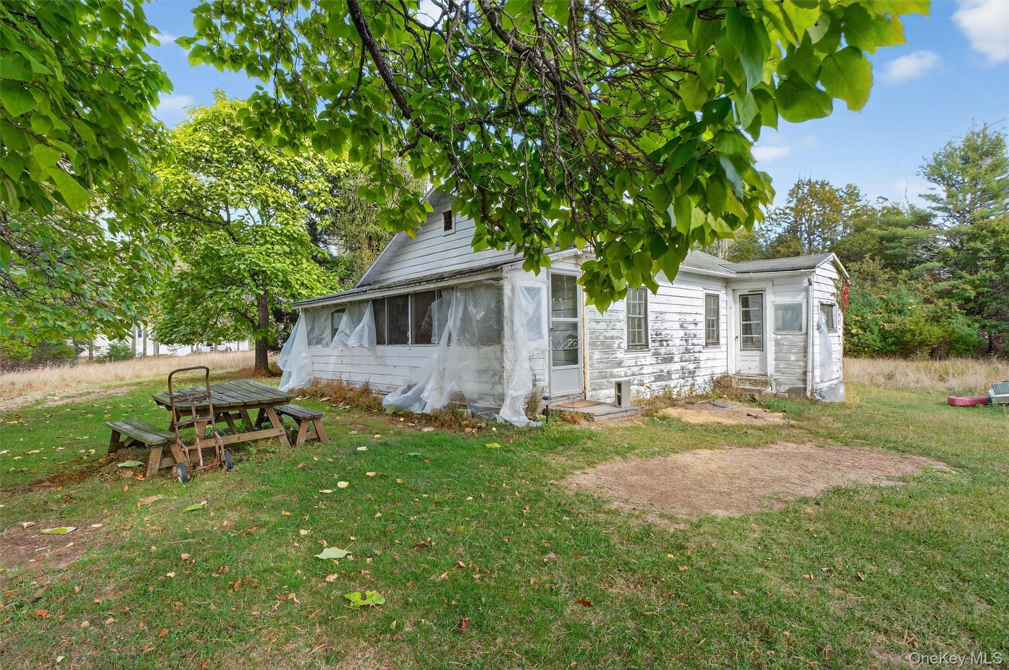 300 Band Camp Road Saugerties, NY 12477 - Photo 20 of 48 a backyard of a house with table and chairs
