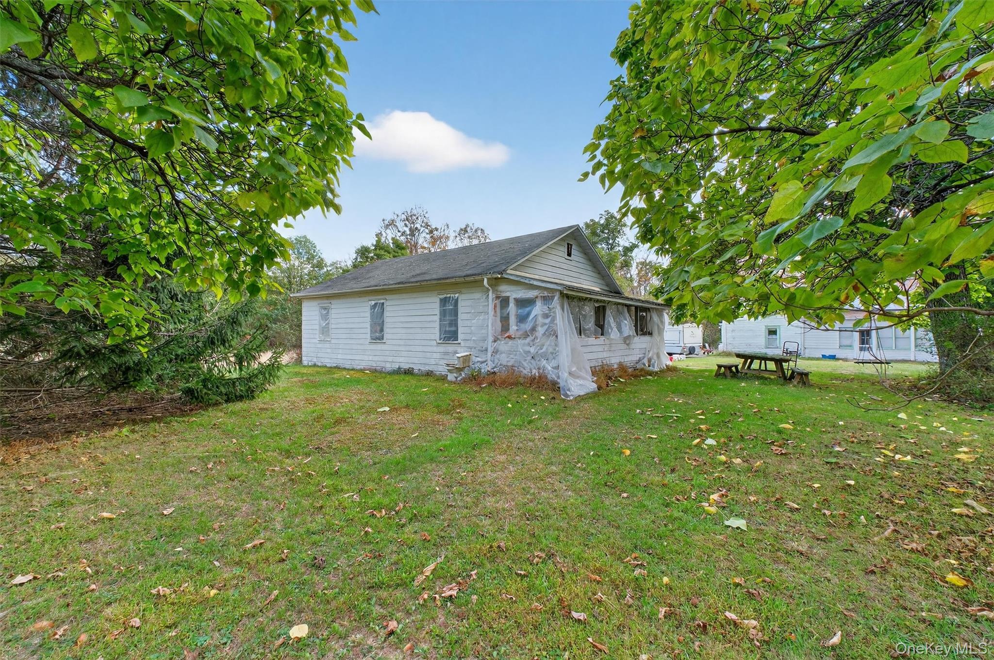 300 Band Camp Road Saugerties, NY 12477 - Photo 21 of 48 a view of a house with backyard and a tree