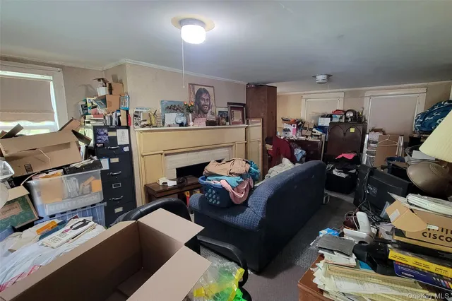 a living room with furniture fireplace and a flat screen tv