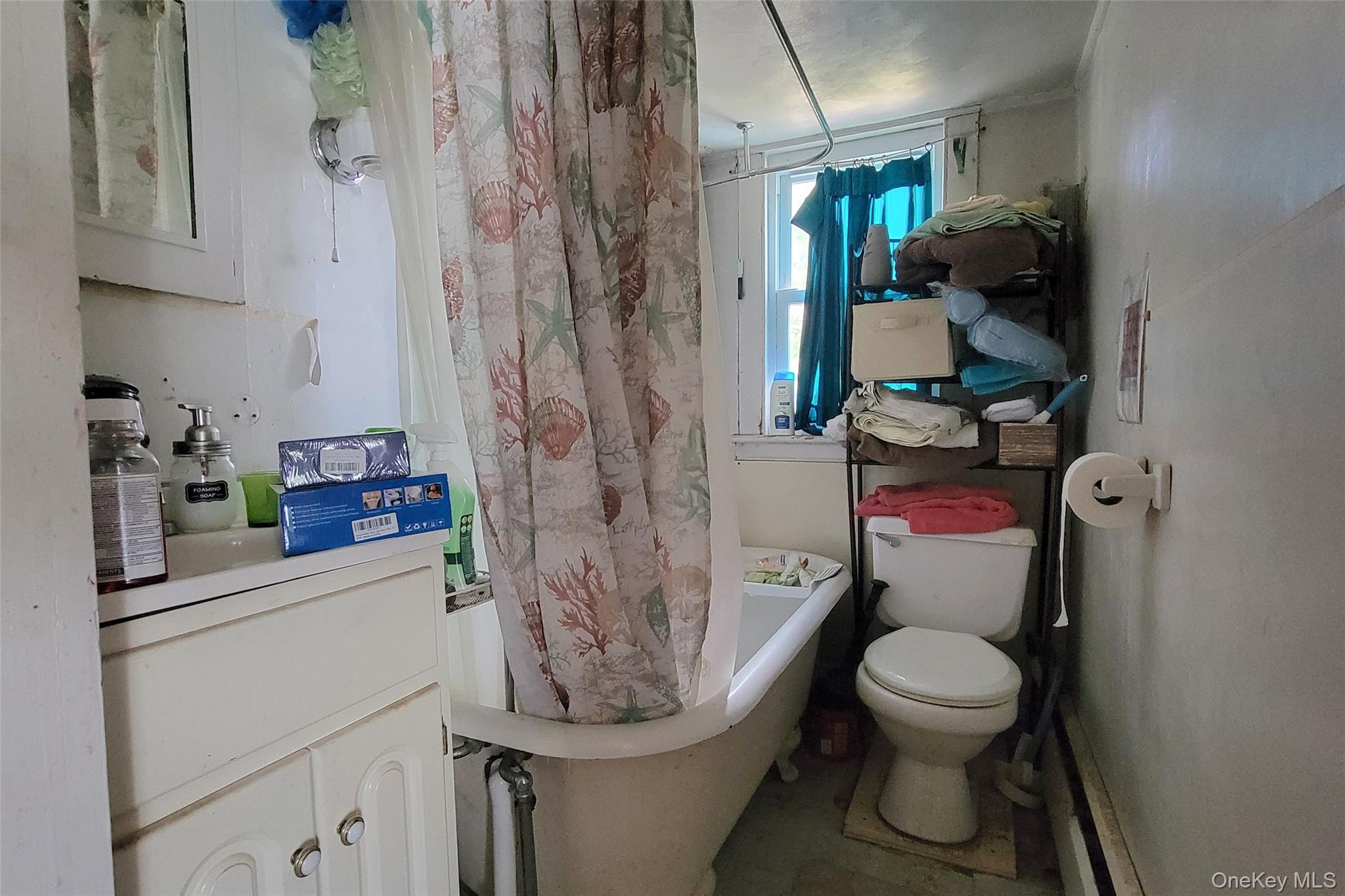 300 Band Camp Road Saugerties, NY 12477 - Photo 38 of 48 a white toilet sitting next to a bathroom sink