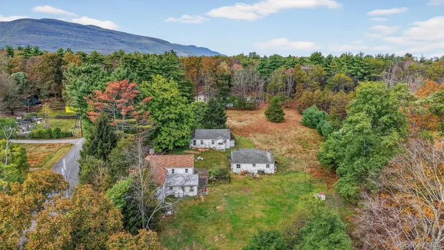an aerial view of a house with a yard