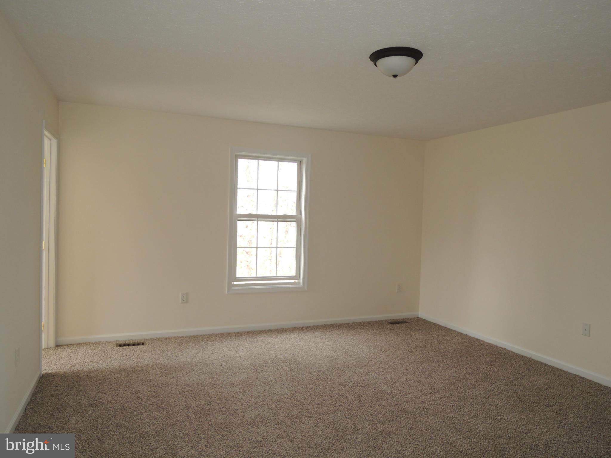 39 Raft Court Inwood, WV 25428 - Photo 12 of 30 an empty room with a window