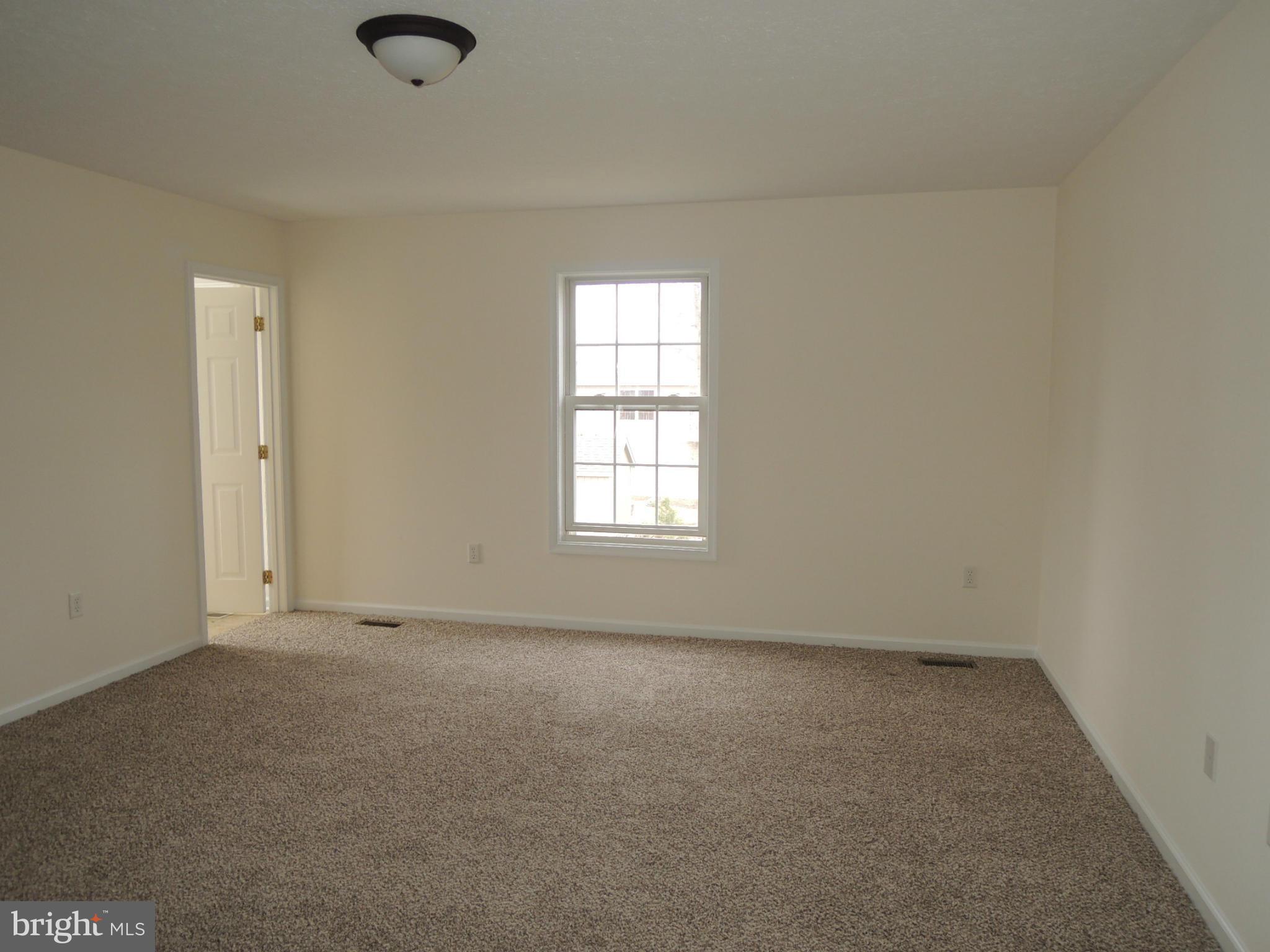 39 Raft Court Inwood, WV 25428 - Photo 13 of 30 an empty room with a window