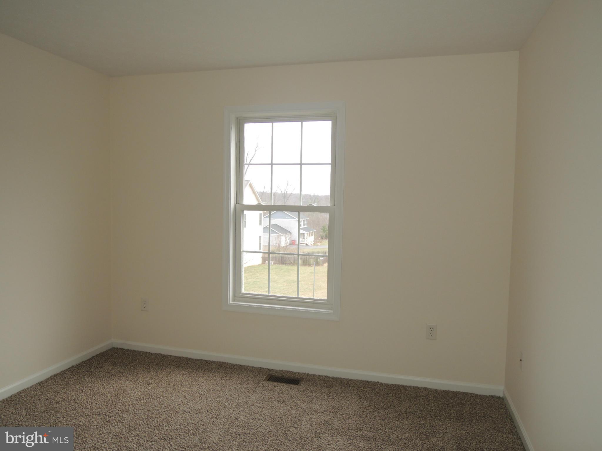 39 Raft Court Inwood, WV 25428 - Photo 22 of 30 an empty room with a window