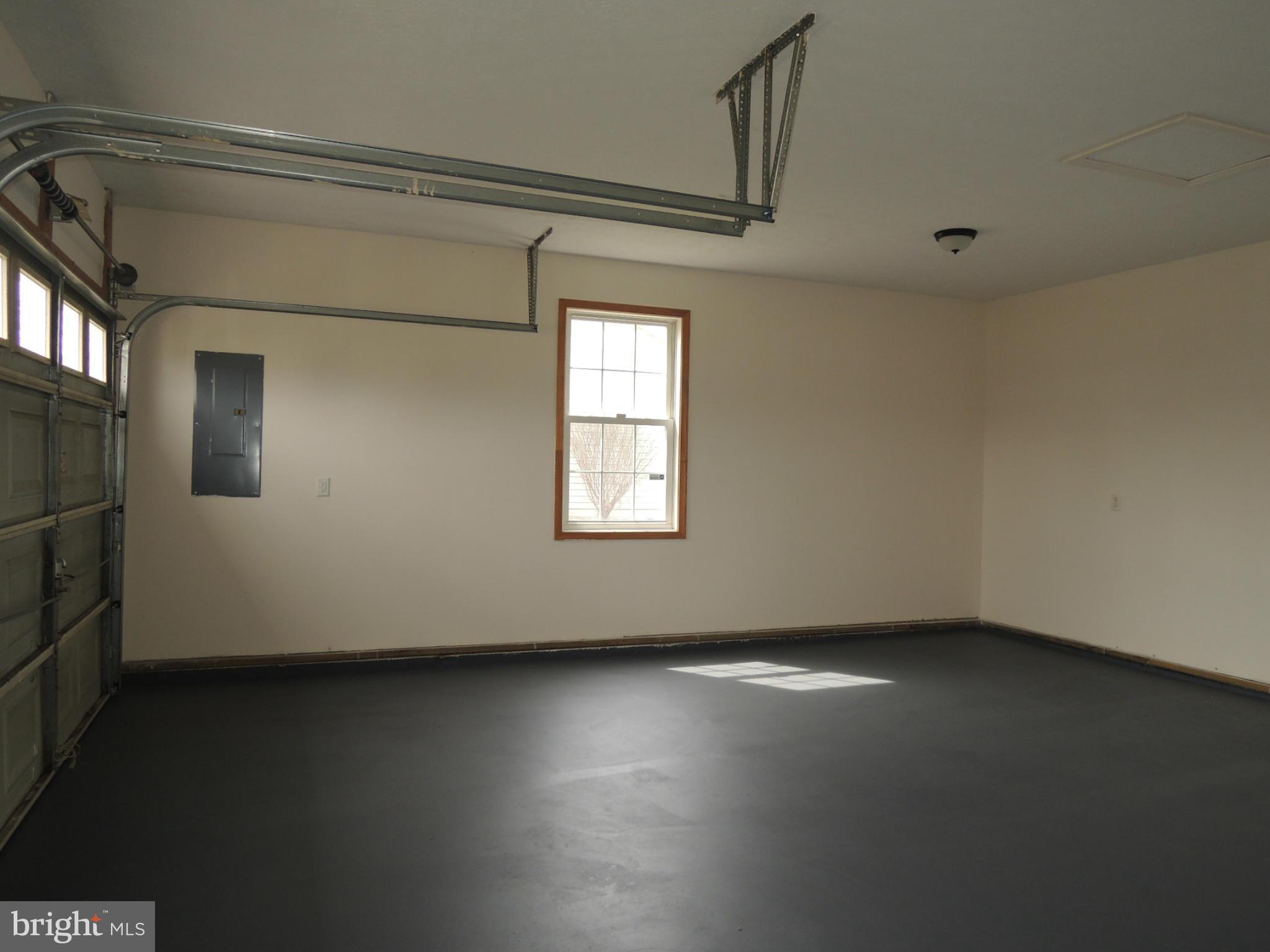 39 Raft Court Inwood, WV 25428 - Photo 30 of 30 a view of an empty room with wooden floor and a window