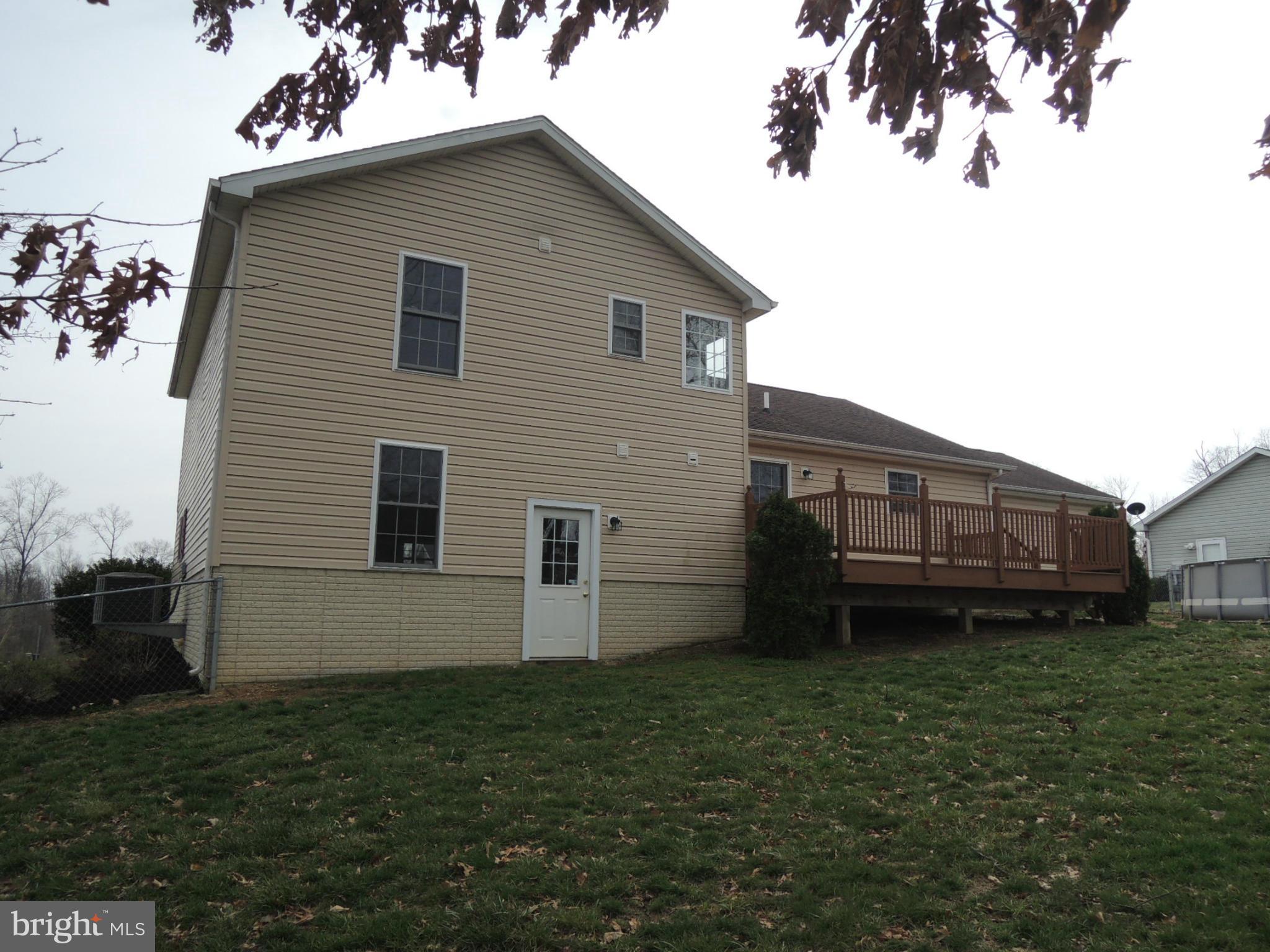 39 Raft Court Inwood, WV 25428 - Photo 4 of 30 a house view with a backyard space