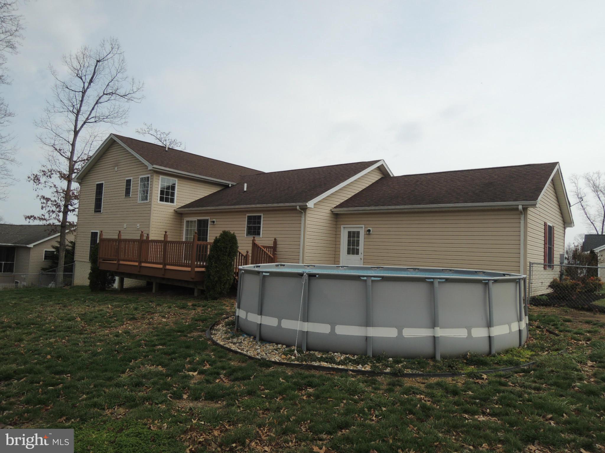 39 Raft Court Inwood, WV 25428 - Photo 5 of 30 a view of a house with a yard