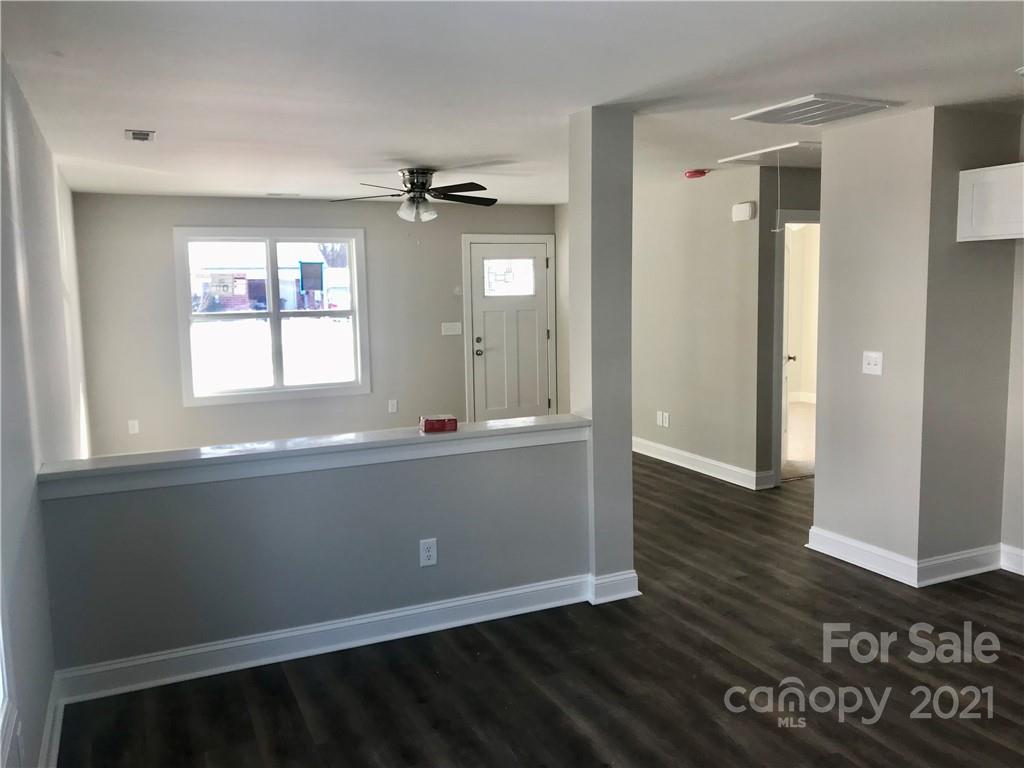 1007 3rd Street Spencer, NC 28159 - Photo 6 of 12 wooden floor and windows in a room