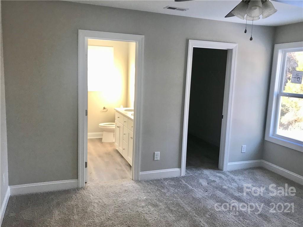 1007 3rd Street Spencer, NC 28159 - Photo 10 of 12 a view of an empty room and a window