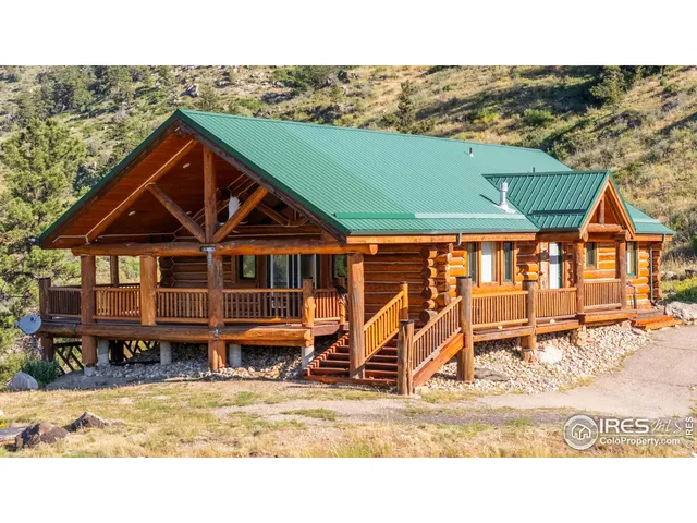 a view of a house with wooden deck
