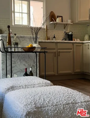 a kitchen with a sink and a stove