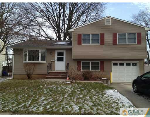 23 Baldwin Road Edison, NJ 08817 - Photo 1 of 19 a front view of a house with garden