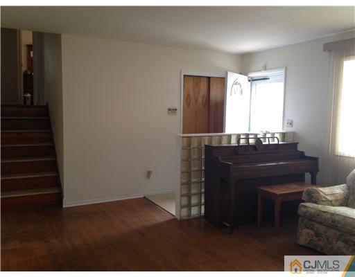 23 Baldwin Road Edison, NJ 08817 - Photo 2 of 19 a room with a piano and a window