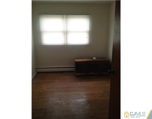 23 Baldwin Road Edison, NJ 08817 - Photo 12 of 19 a view of room with a window and cabinet
