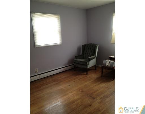 23 Baldwin Road Edison, NJ 08817 - Photo 13 of 19 a living room with furniture and a piano