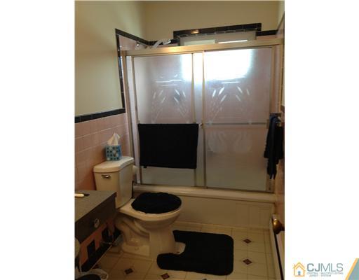 23 Baldwin Road Edison, NJ 08817 - Photo 17 of 19 a bathroom with a toilet and a shower
