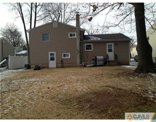 23 Baldwin Road Edison, NJ 08817 - Photo 19 of 19 a backyard of a house with yard and garage