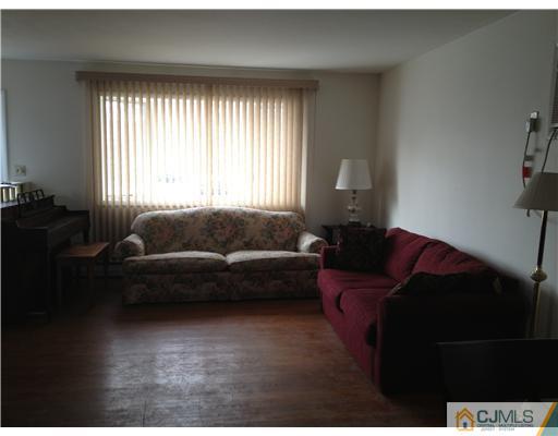 23 Baldwin Road Edison, NJ 08817 - Photo 3 of 19 a living room with furniture and a window