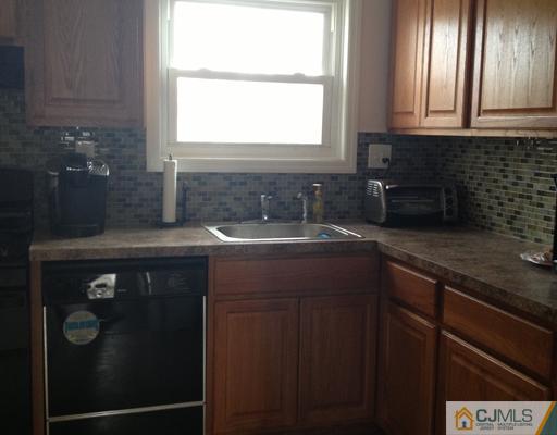 23 Baldwin Road Edison, NJ 08817 - Photo 7 of 19 a kitchen with sink cabinets and window