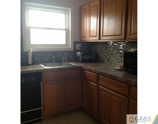 23 Baldwin Road Edison, NJ 08817 - Photo 8 of 19 a bathroom with a sink and a window