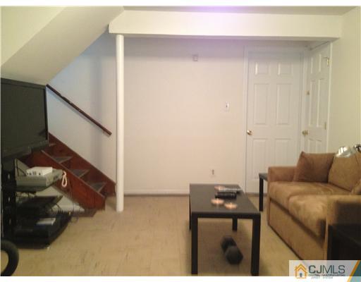 23 Baldwin Road Edison, NJ 08817 - Photo 9 of 19 a living room with furniture and stairs