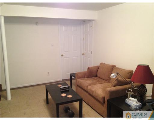 23 Baldwin Road Edison, NJ 08817 - Photo 10 of 19 a living room with furniture and a window