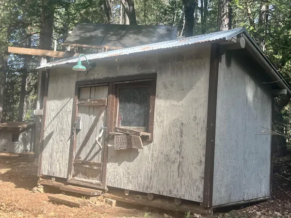 a kitchen with a refrigerator a stove a sink and a cabinets