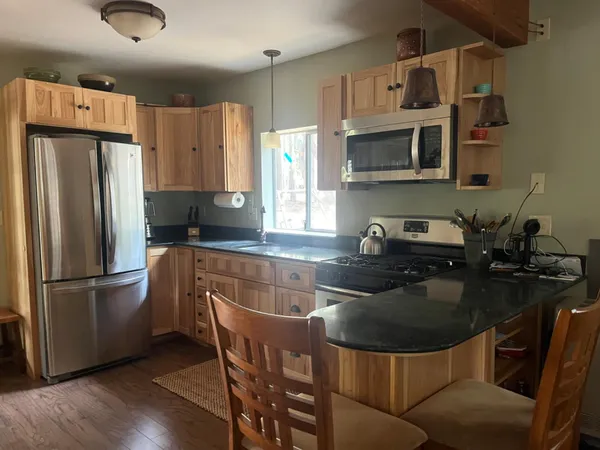 a dining room with furniture and window