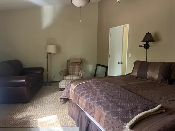 a view of a door with a wooden fence