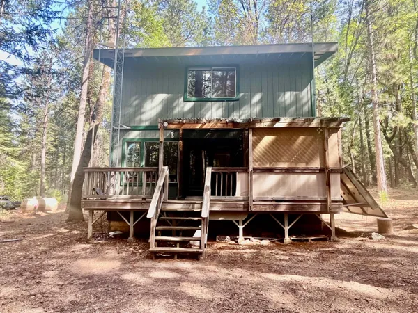 a house with a tree in front of it