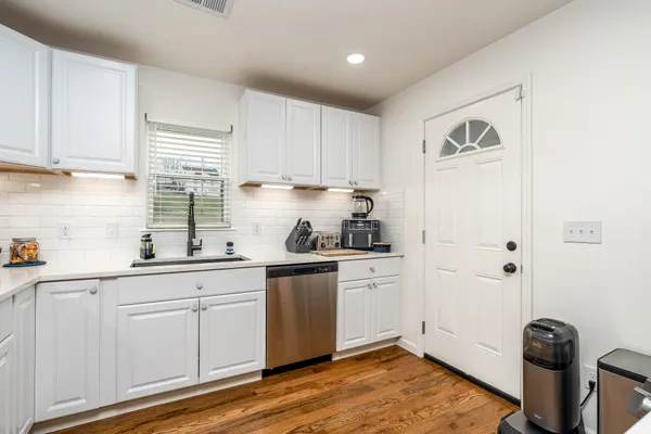 a kitchen with sink cabinets and window