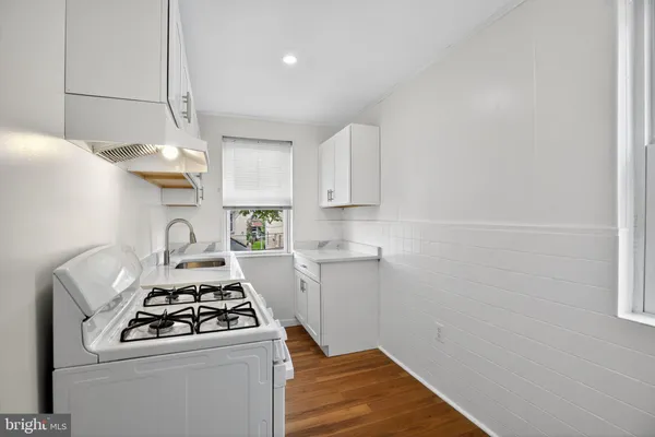 a kitchen with a stove and a refrigerator