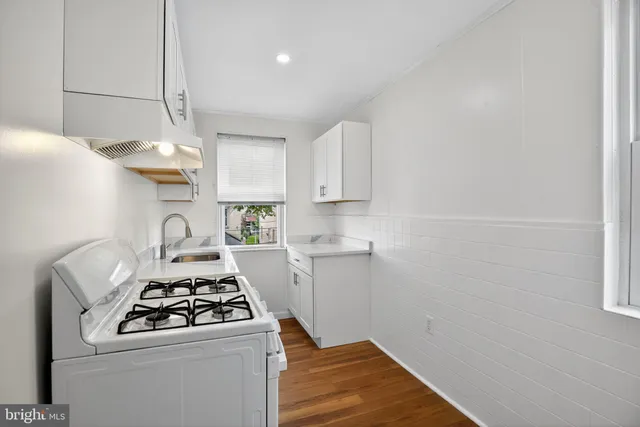 a kitchen with a stove and a refrigerator