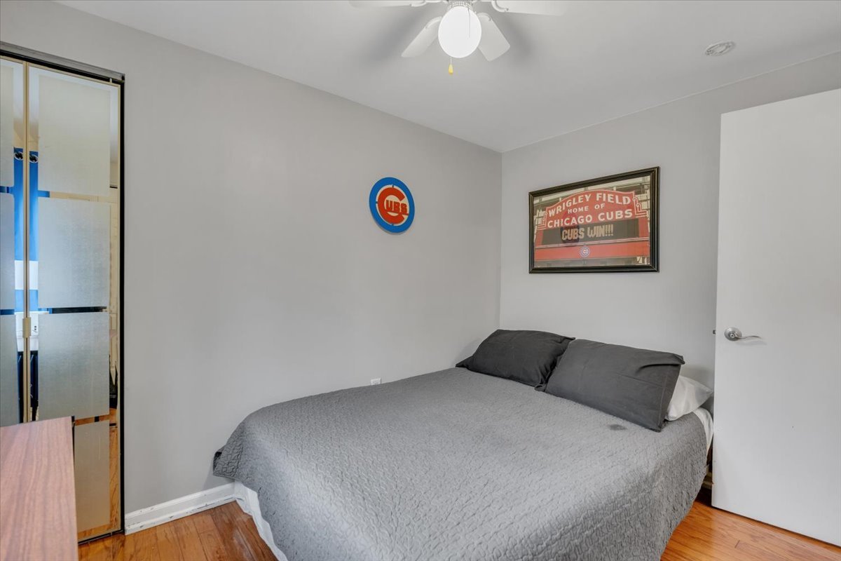 5220 Palm Street Barrington, IL 60010 - Photo 11 of 22 a bedroom with a bed and a painting on the wall