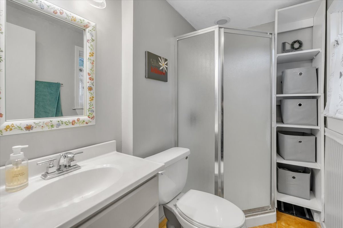 5220 Palm Street Barrington, IL 60010 - Photo 12 of 22 a bathroom with a sink a toilet and shower