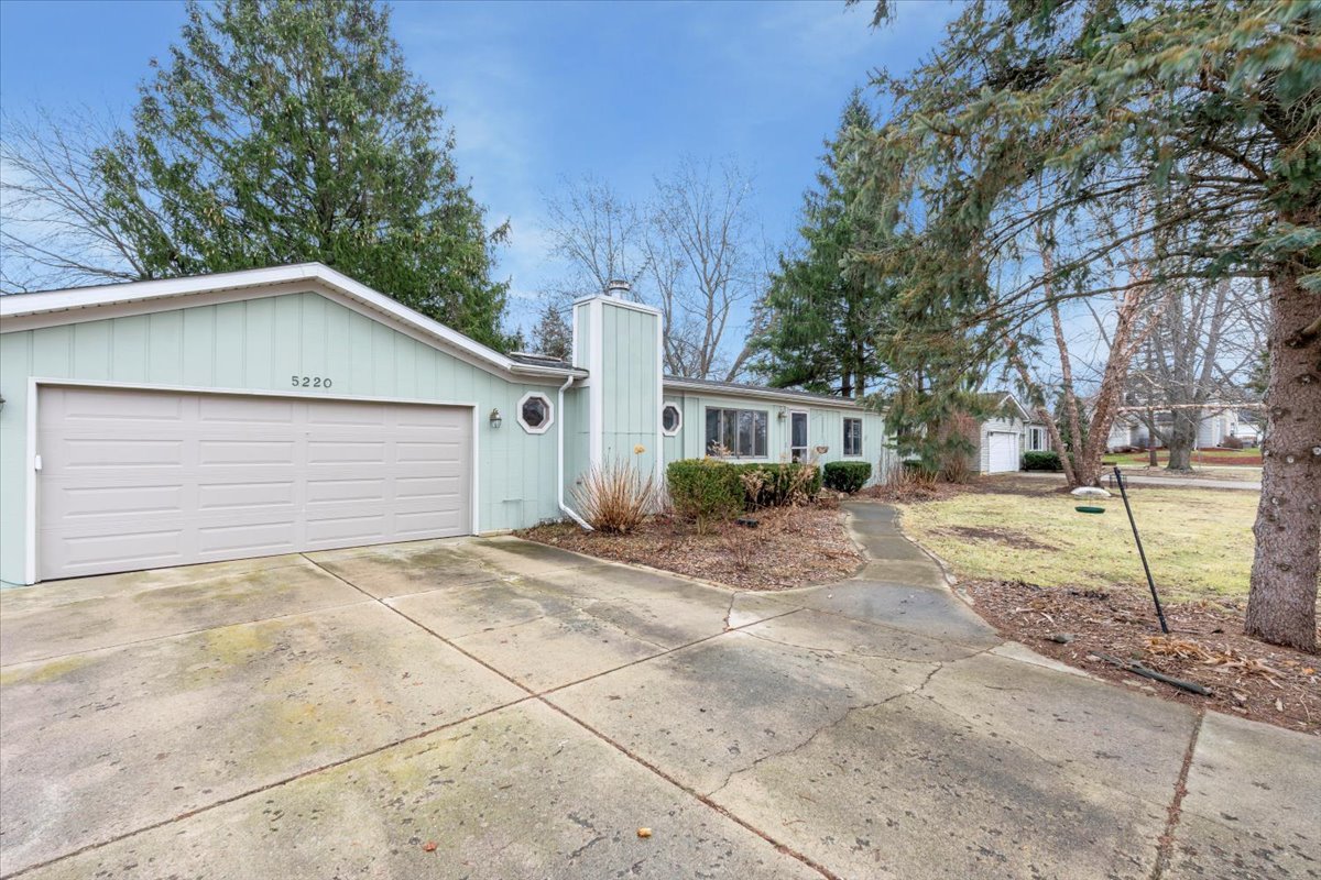 5220 Palm Street Barrington, IL 60010 - Photo 20 of 22 a view of a house with a yard and garage