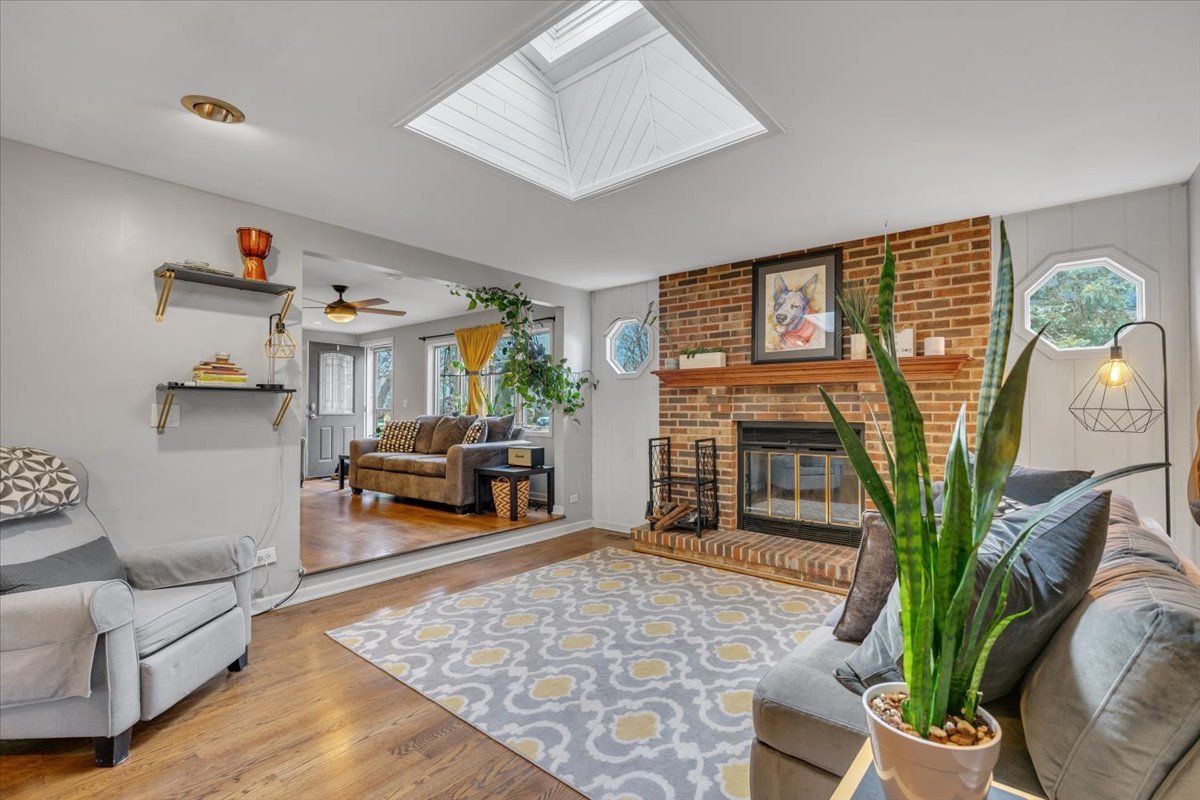 5220 Palm Street Barrington, IL 60010 - Photo 4 of 22 a living room with furniture floor to ceiling window and potted plant